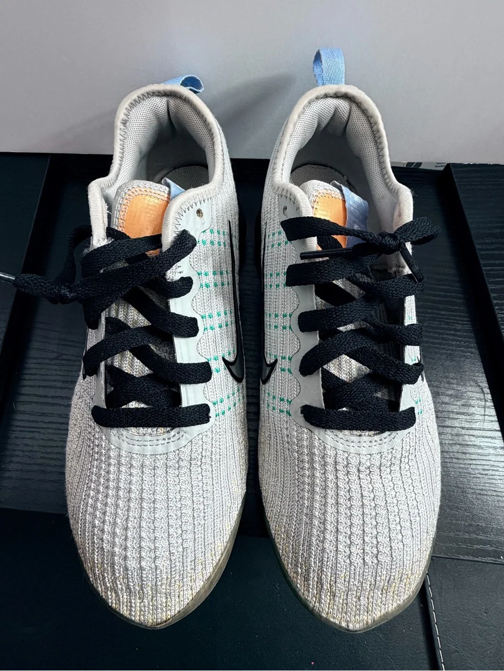 Nike Men’s White Knit Sneakers with Black Accents and Teal Dots